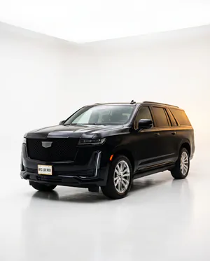 Black Cadillac Escalade ESV in a white studio