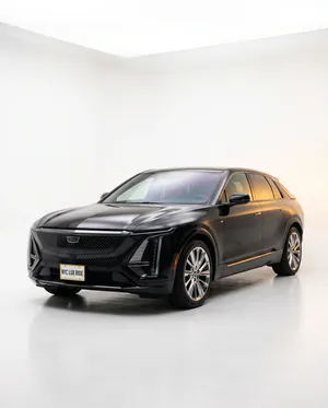 Black Cadillac Lyriq in a white studio
