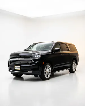 Black Chevrolet Suburban in a white studio